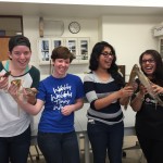 Students with taxidermied small mammals.